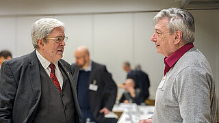 Photo of Economics Minister Prof Steinbach in conversation with Dr Harry Lehmann.