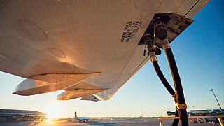 An aeroplane is being refuelled.