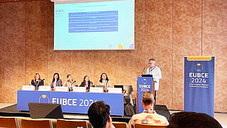 Dr Harry Lehmann, Head of the PtX Lab Lausitz, moderates a panel discussion at the EUBCE