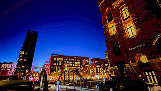Hamburg at night, on the right is the illuminated International Maritime Museum