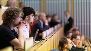 Students in a lecture theatre during a lecture.